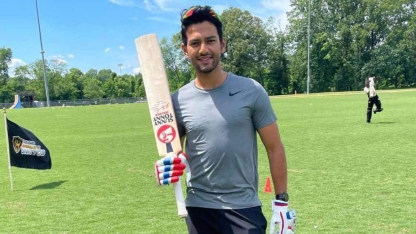 Unmukt Chand holding a cricket bat